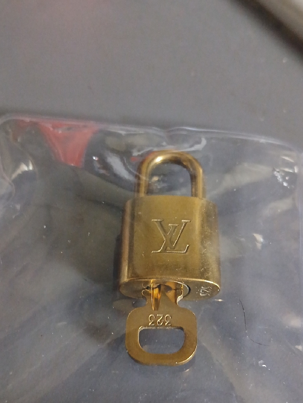 Louis Vuitton Gold-Tone LV Logo Padlock with Key
